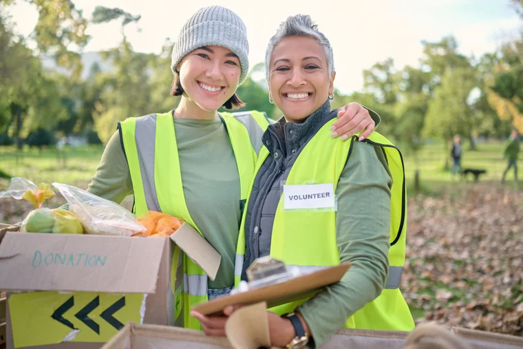 volunteers holding donations