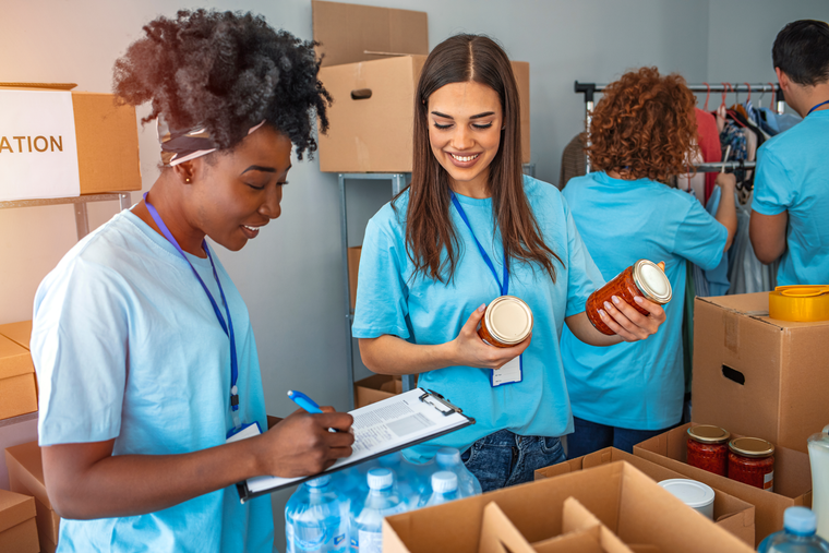 volunteers with canned goods