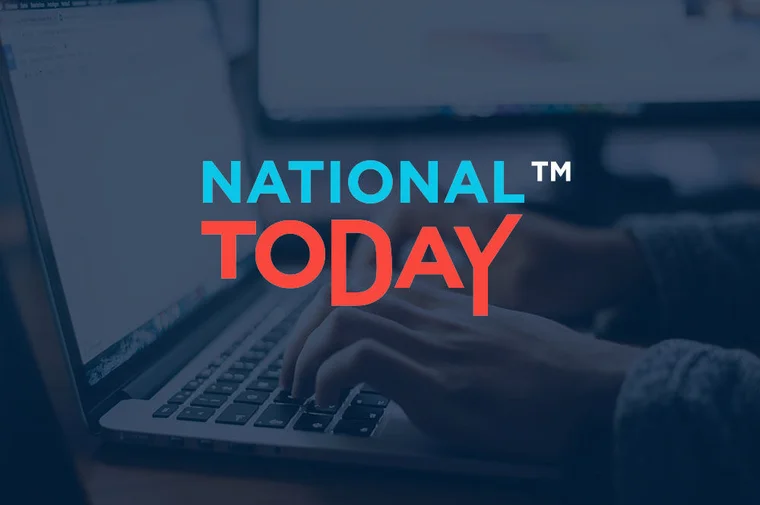 National Today logo over an image of someone typing on a laptop