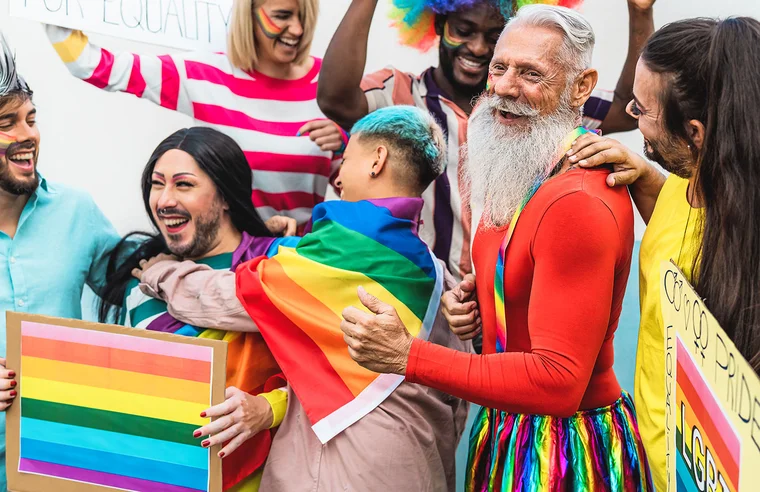 Group of diverse LGBTQIA+ community members celebrating Pride