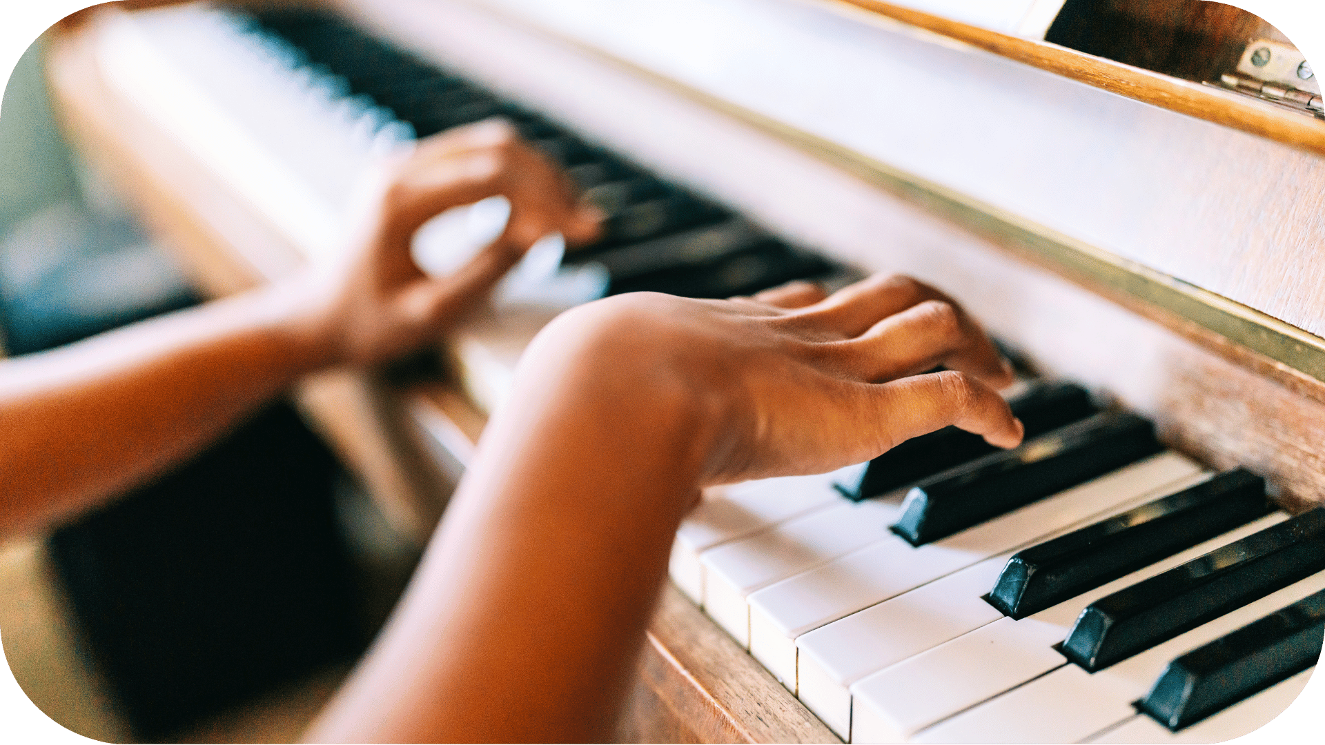 Young hands playing piano